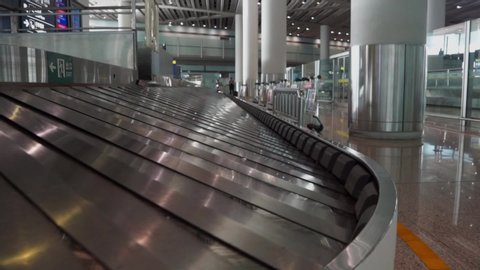 Close up of an empty airport baggage conveyor belt for luggage. Concept of tourism and travel.