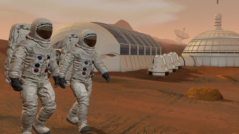 Colony on Mars. Two Astronauts Walking On The Surface Of Mars. Exploring Mission To Mars. Futuristic Colonization and Space Exploration Concept.
