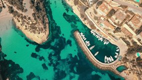 Aerial drone shot, Blue Lagoon island 4k travel video. Eye view on the sea coastline with pier and yacht at sunny day. Travel, journey, islands, Seascape, freedom, holidays concept