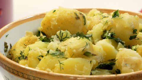 Steam over appetizing boiled potatoes with dill. Close up 4k