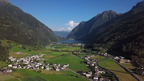 Aerial panorama of Val Poschiavo valley and Lago di Poschiavo lake near Bernina Pass, Graubunden, Switzerland.