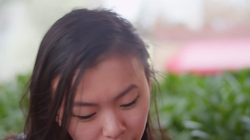 Close up of a young woman talking to somebody