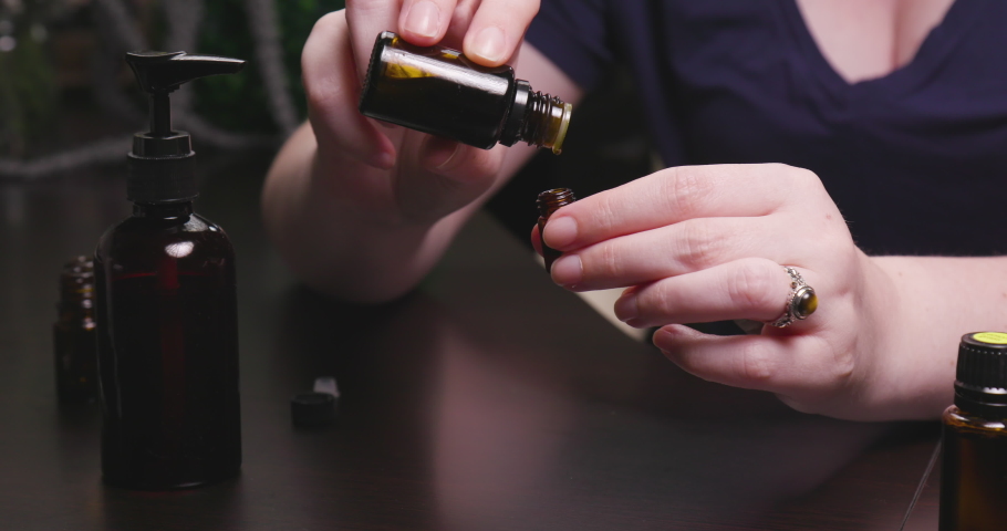 Women Mixing Essential Oils Together into Vial | Shutterstock HD Video #1033232642