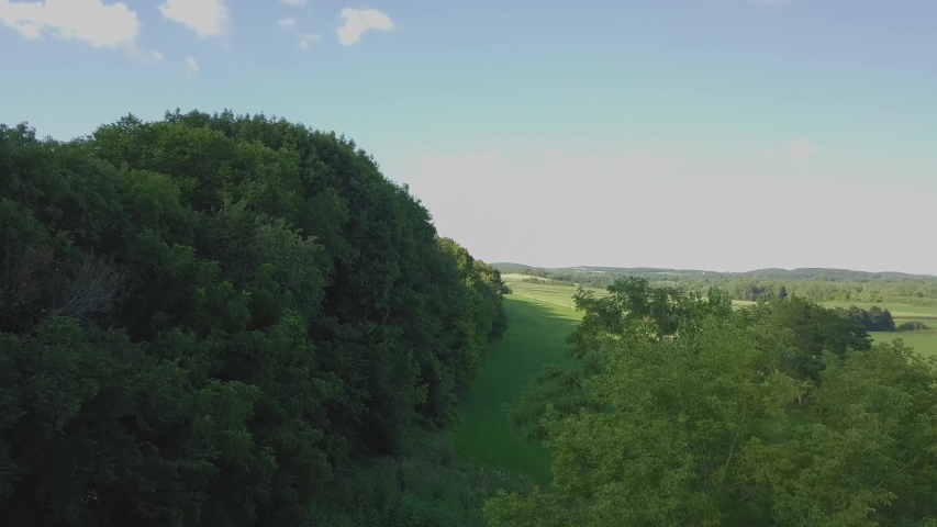 aerial Shot of Rural Southern wisconsin Hillside mid summer. 4k 24fps
