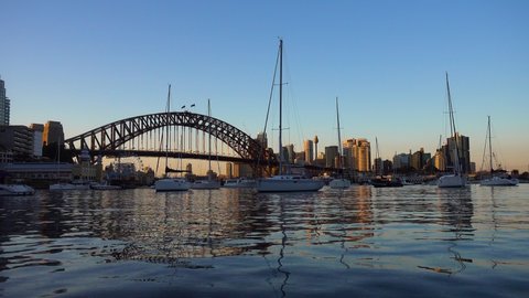 Time lapse of boats in front of the Harbour bridge in Sidney