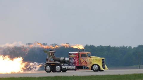 FORT WAYNE, INDIANA / USA - June 9, 2019: The Shockwave Jet Truck spews fire and smoke while performing at the 2019 Fort Wayne Airshow.