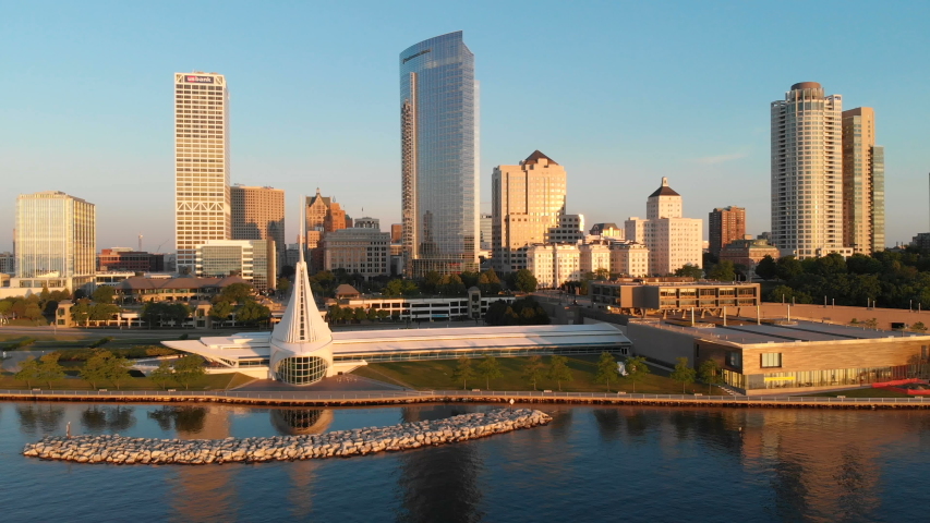 Aerial view of american city at dawn. High-rise  buildings, Michigan lake shoreline, Milwaukee Art Museum.  Sunny morning. Milwaukee, Wisconsin, USA