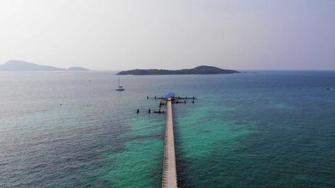 View of a pier on the tropical island, shooting from air
