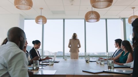 beautiful business woman team leader discussing creative ideas with shareholders briefing colleagues sharing company development strategy in office boardroom meeting 4k