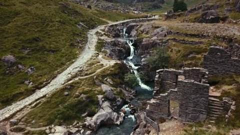 SNOWDONIA, WALES- UK : Aerial view of Mount Snowdon hiking path- the Watkins Path and beautiful mountain stream in Snowdonia National Park 
