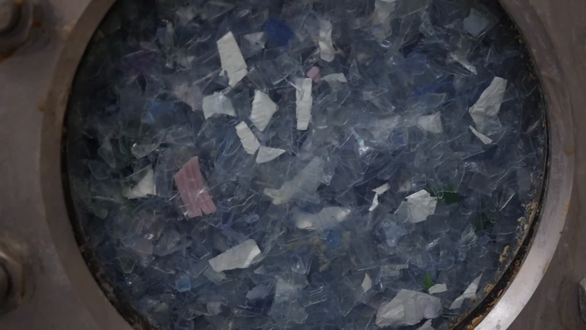 washing plastic pieces-detail -plastic recycling process Royalty-Free Stock Footage #1033271966
