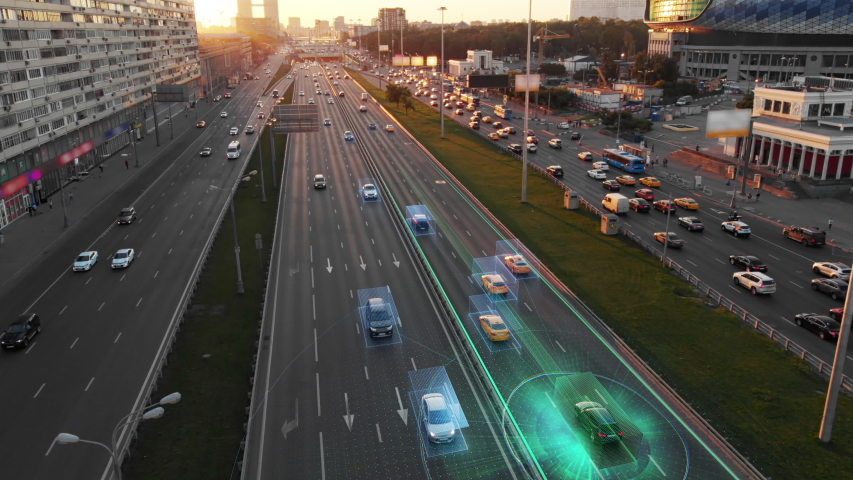 Beautiful aerial view to autonomous cars self-driving on the highway in Moscow. Picturesque aerial panorama of the road traffic in a big city on the sunset. | Shutterstock HD Video #1033280714