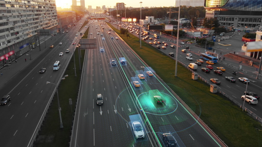 Beautiful aerial view to autonomous cars self-driving on the highway in Moscow. Picturesque aerial panorama of the road traffic in a big city on the sunset. Royalty-Free Stock Footage #1033280714