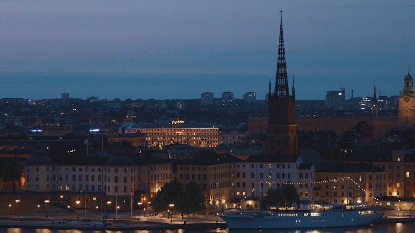 Stockholm, Sweden. Night View Of Building Of Riddarholm Kyrka Or Riddarholm Church, The Burial Place Of Swedish Monarchs On The Island Of Riddarholmen. Night Cityscape Skyline
