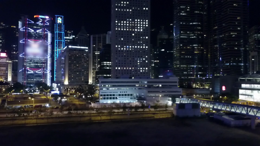 Aerial: Crowded Hong Kong Skyscrapers Lit Up at Night