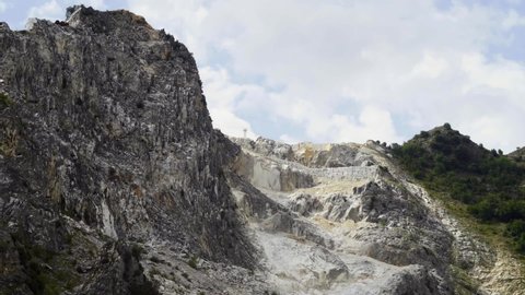 aerial timelapse video of a white Carrara marble quarry in the park of the Apuan Alps