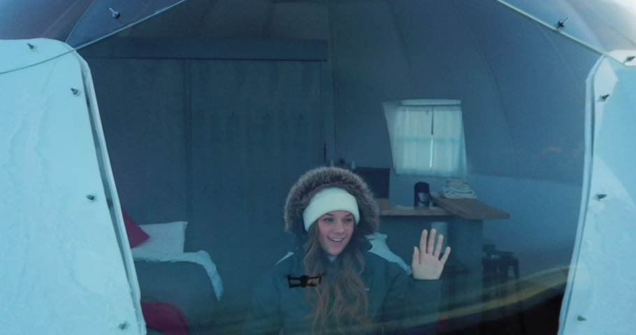 Aerial Exit/Ascend: Woman Looking Out Window Of Igloo, Fairbanks, Alaska