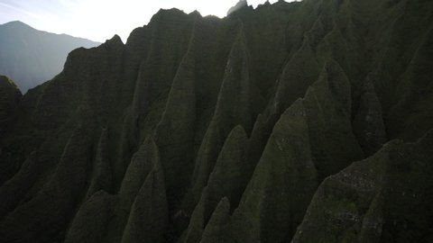 Pan Down: Jagged, Mossy Hawaiian Mountains, Feet Dangling From Helicopter, Kauai, Hawaii