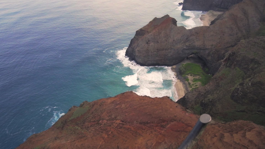 Slow Motion/Ascend: Blue Ocean Waves Crashing On Rocky Hawaiian Mountains, Kauai, Hawaii