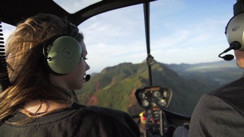 Slow Motion: Shot from Behind Young Woman in Helicopter Turns Head, Kauai, Hawaii