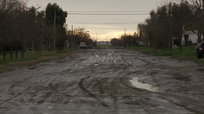 Muddy Road in Small Town Neighborhood, Evening Light, Argentina