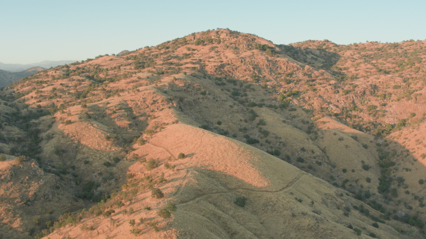 Aerial Drone Shot Ascending Over the Top of a Mountain to Reveal Vast Rolling Hills (Lake Kaweah, Visalia, California)