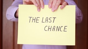 Ripping up yellow sheet with "The last chance" inscription - Powered by Shutterstock - Get 15% off with code: PIKWIZARD15