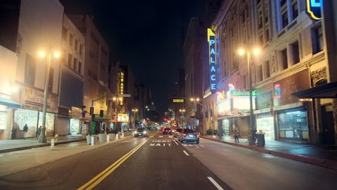 Los Angeles, CA / United States - 01 24 2019: POV driving on Broadway at Night, Downtown Los Angeles