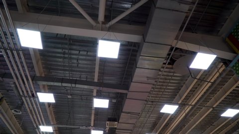 air duct ventilation pipes on ceiling of big industrial building