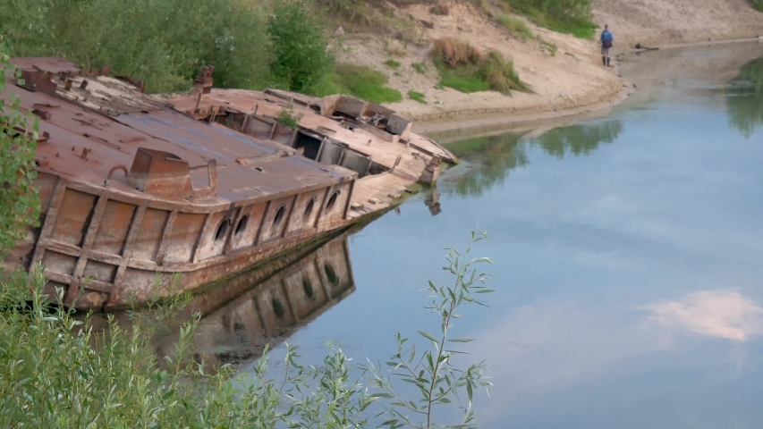 GOMEL, BELARUS old rusty metal river barge on the bay