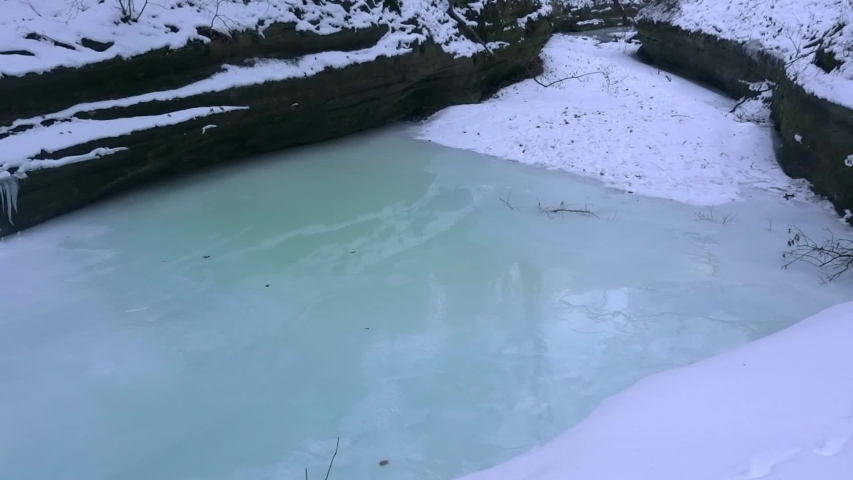 A view of the frozen waterfall and ice at Lasalle Canyon at Starved Rock State Park in Illinois