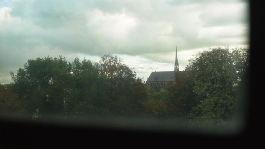 Static clip of a huge church in Zwolle, as seen from behind a window.