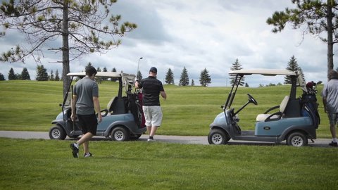 Toronto, Canada - 02 04 2019: Group of golfers packing up their carts and driving to the next tee.