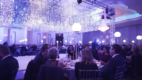 Toronto, Canada - 02 04 2019: Crowded corporate holiday party in a large ballroom.