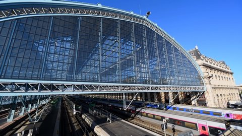 Bordeaux, France, July 2019, Timelapse Gare Saint-Jean in Bordeaux, exterior of the main glass hall of the railway station with TGV on the rails