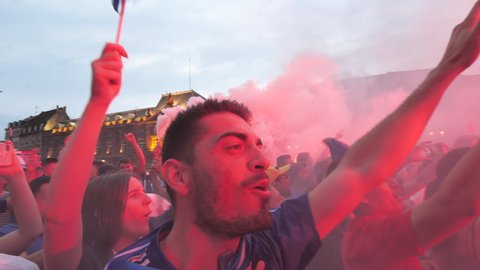 STRASBOURG, FRANCE - JULY 15, 2018: Crowd singing la Marseillaise Happiness and jubilation of supporters after the victory of the French team in the final of the World Cup football against Croatia