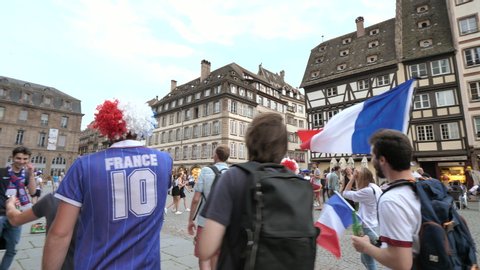 STRASBOURG, FRANCE - JULY 15, 2018: Friends jubilation supporters after the victory of the French team in the final of the World Cup football in Russia against Croatia