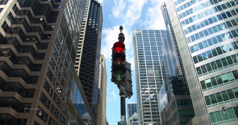 Chicago traffic light turns from red to green at downtown skyscrapers financial district intersection