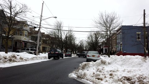 A snowy street in a low socio economic town.