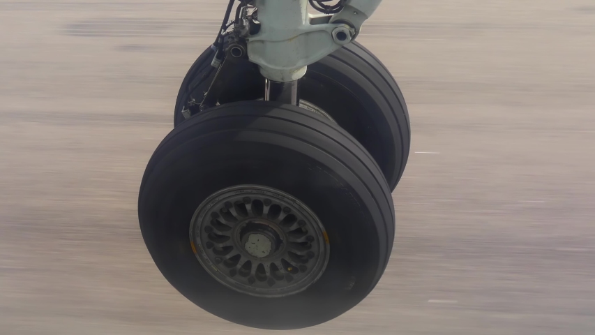 View on airplane wheel at landing, 4k close up shot