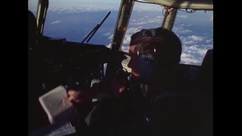 CIRCA 1977 - Footage shot in a C-130 shows the pilots navigating the aircraft.