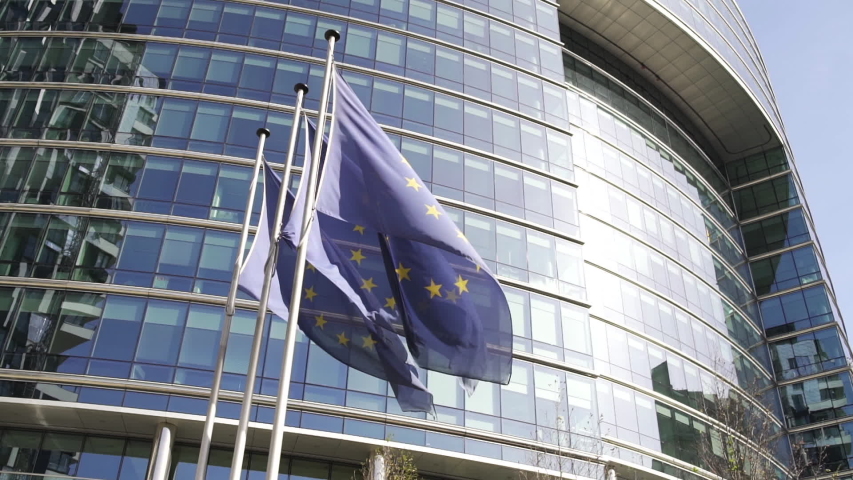 European flags waving in front of modern building in the European District in the city center of Brussels, Belgium.

The parliament and council buildings are here. Brussels is the capital of Europe. Royalty-Free Stock Footage #1033379297