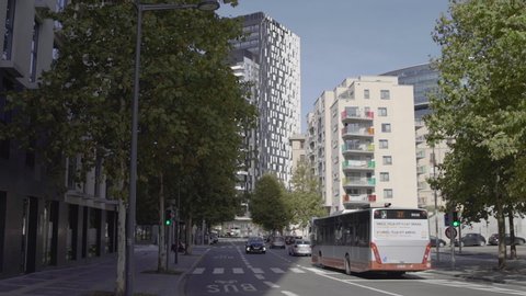 MIVB city bus and traffic in the modern city center of brussels in Belgium. Public transport is convenient in Brussels.

A smooth travel shot with a gimbal right when the bus passes.