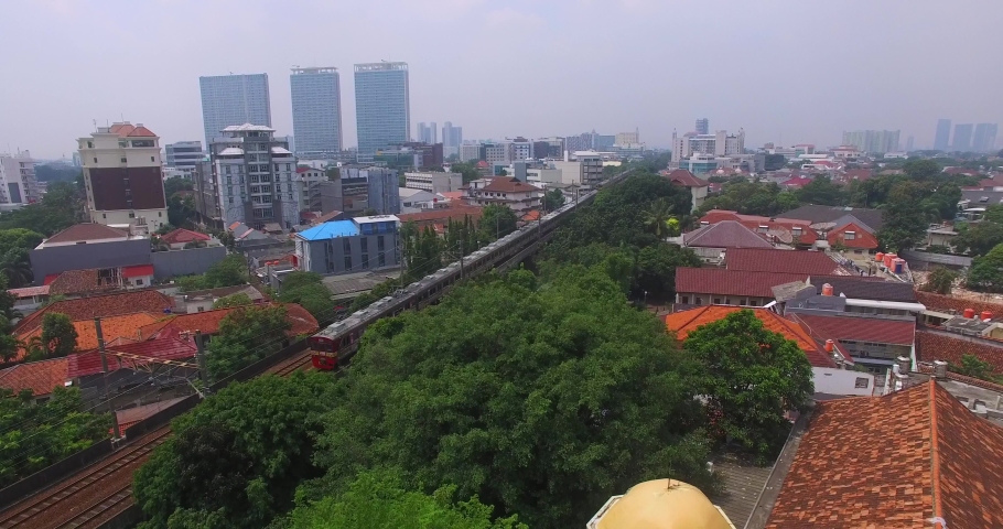 Jakarta indonesia - july 14 2019 : krl commuterline indonesia jakarta at  rush hour. aerial kereta commuter indonesia on platform of jakarta kota  station with building background