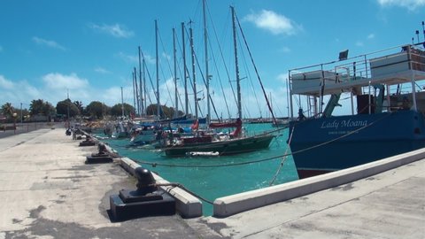 RAROTONGA, COOK ISLANDS - JULY 6, 2013: Avatiu Harbour or Avarua Harbour. Marina with boats mooring in the Port of Avatiu in Rarotonga Cook islands biggest port in South Pacific Polynesia