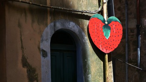 sign of a huge strawberry, culinary symbol of Nemi