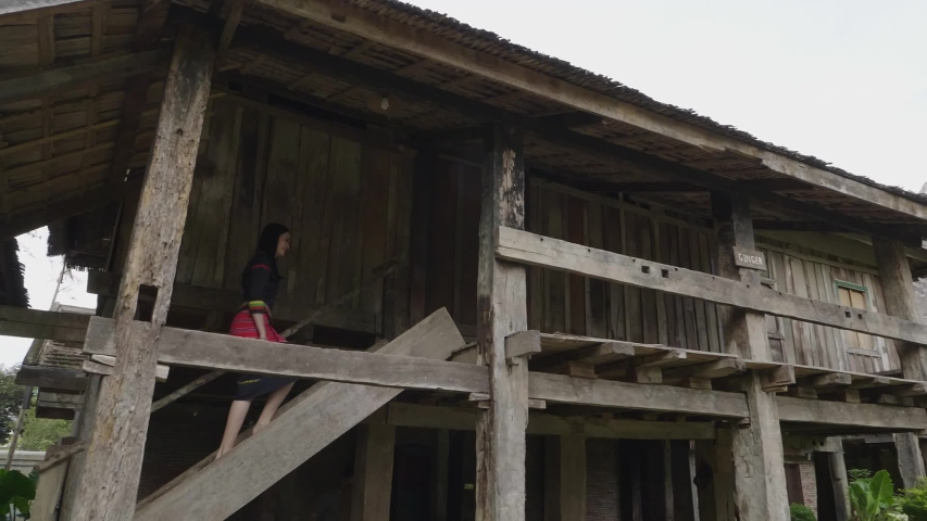 Khmu Girl Walking Upstairs In Khmu House
