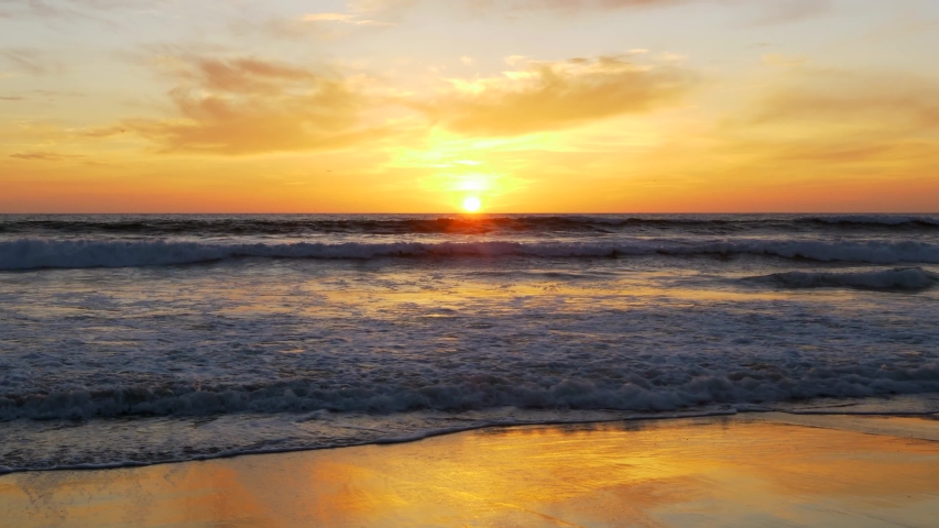 Waves crashing at shore during a gorgeous sunset in Mission Beach California. | Shutterstock HD Video #1033432601