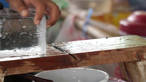 Traditional Thai wooden manual ice shaver machine.