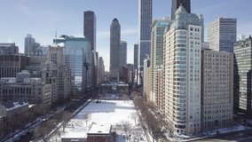 Aerial view of Chicago Downtown In Winter next to frozen lake Michigan - Shot with Colorgrading